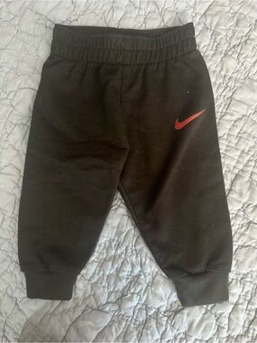 Nike Black Kids Sweatpants with Red Swoosh